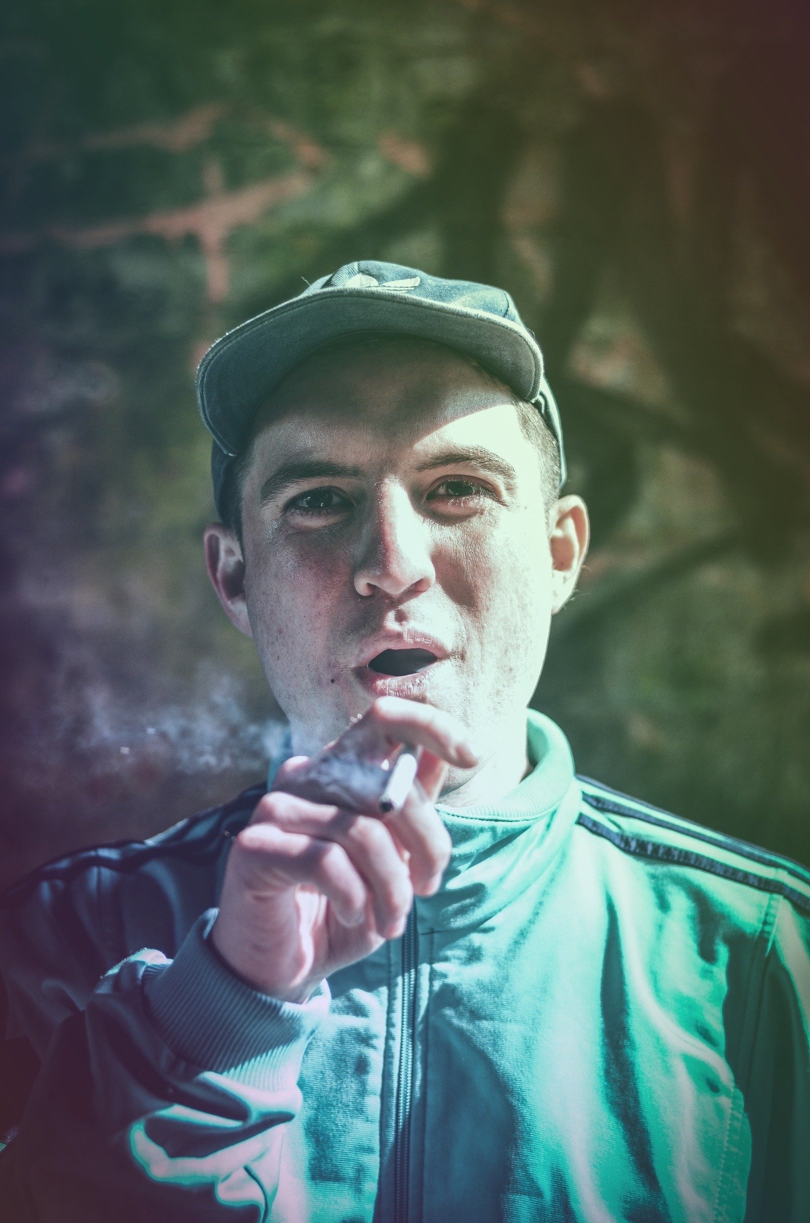 Portrait of a performer in teal light
