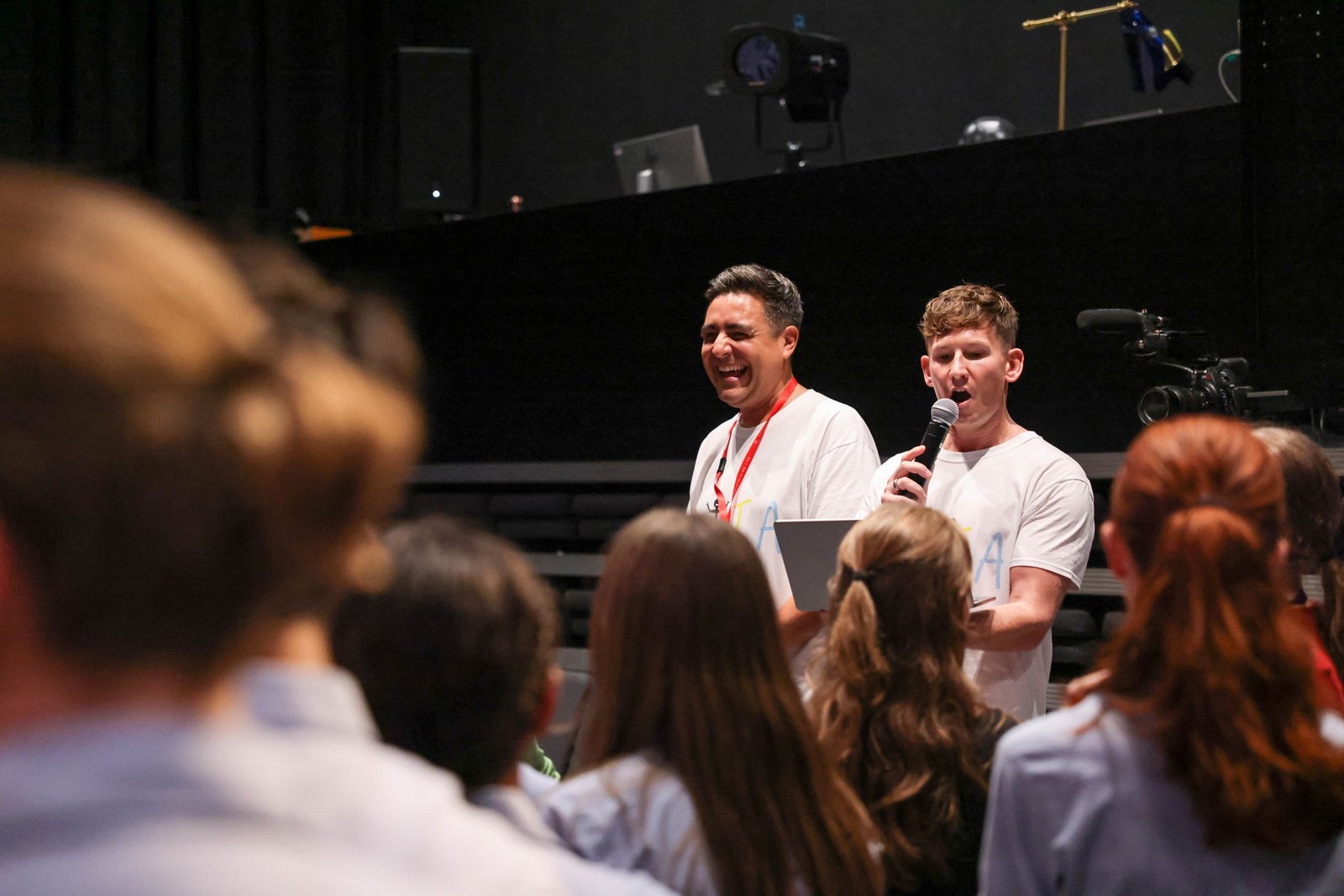 Speakers addressing an audience